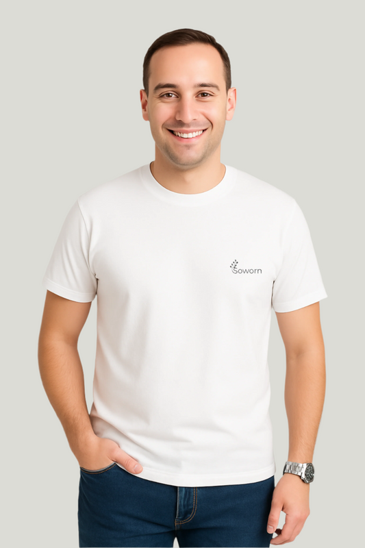 Man wearing a white t-shirt with a logo on a plain background
