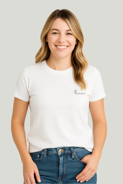 Woman wearing a white t-shirt with a logo on a plain background